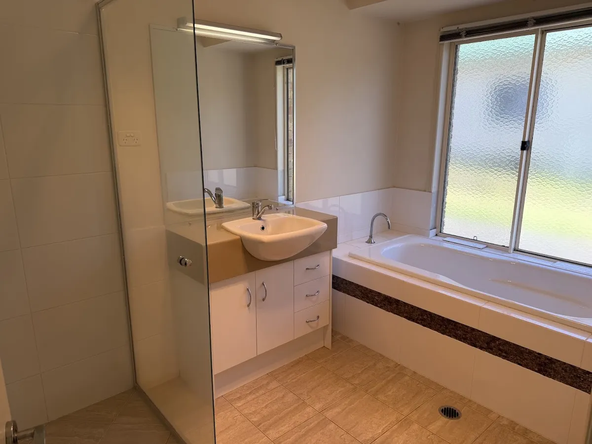 Main bathroom with separate bath and shower