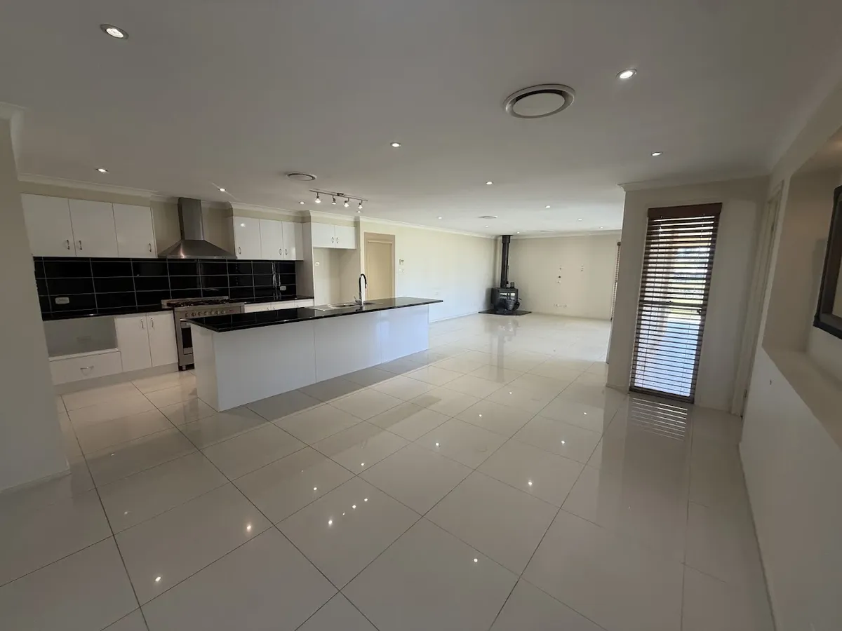 Open plan kitchen and family area with wood fire