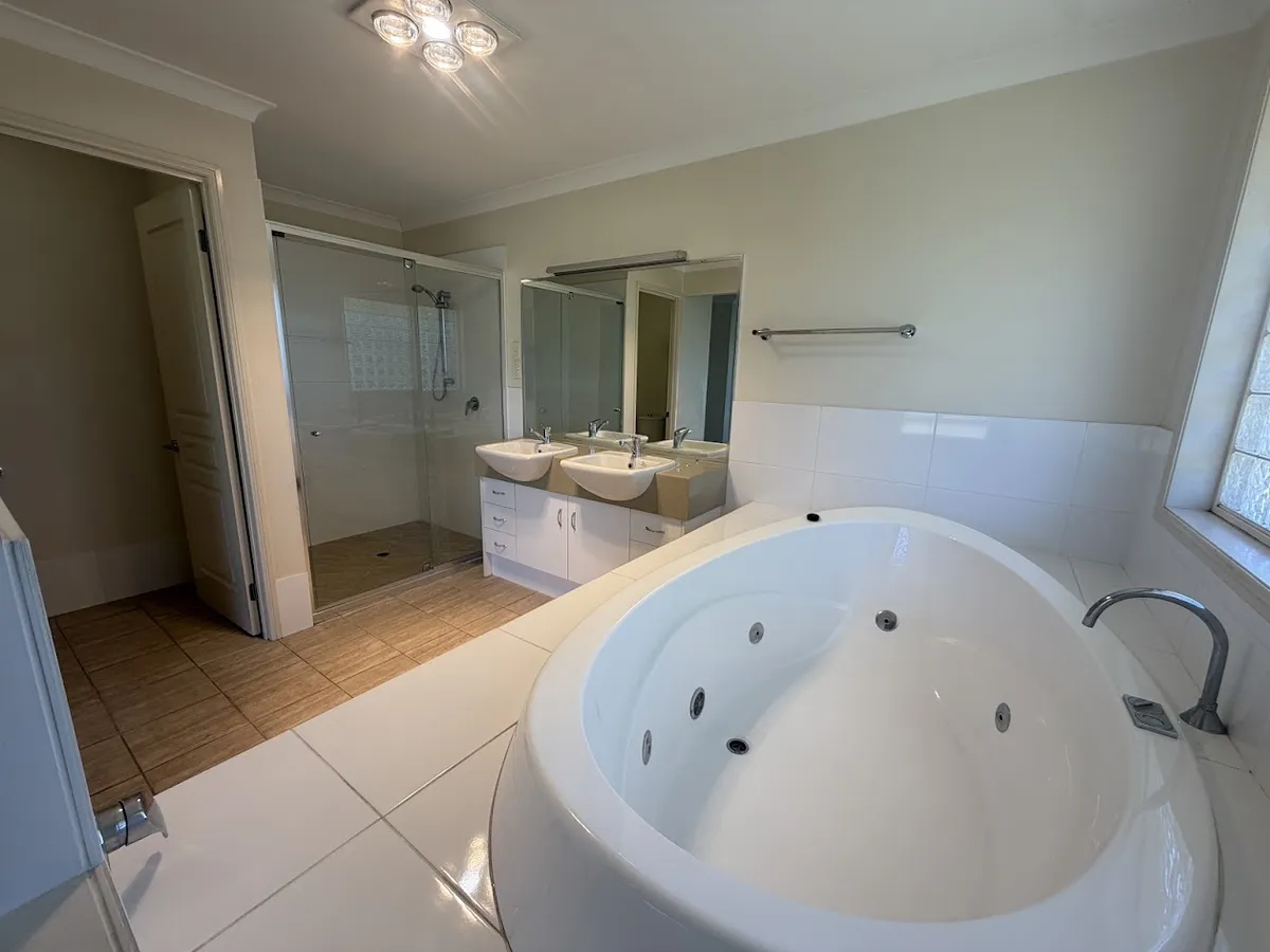 Ensuite with corner spa and twin basins