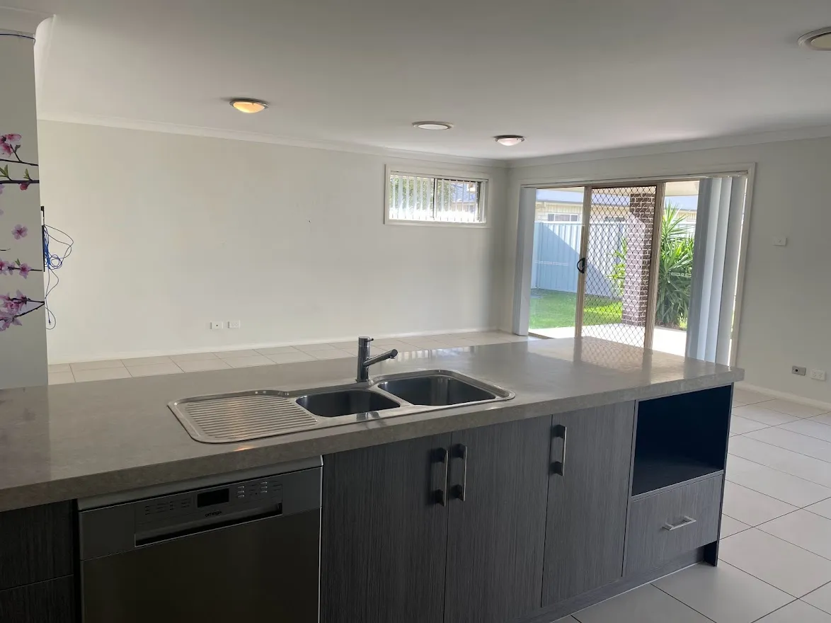 Kitchen island with dishwasher, overlooking the living area