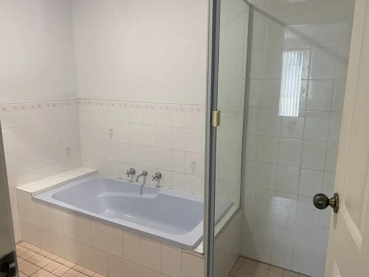 Bathroom with bath and shower